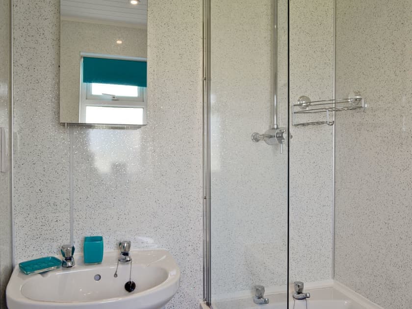 Bathroom with shower over bath | Puffins, Port Isaac