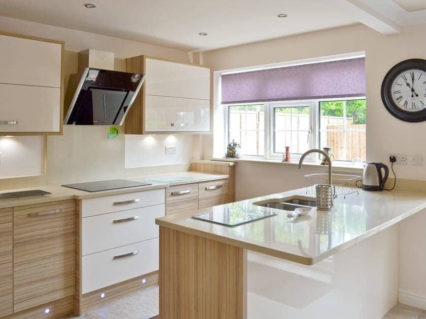 Modern kitchen with ‘breakfast bar’ | Smitten Cottage, Rhyl