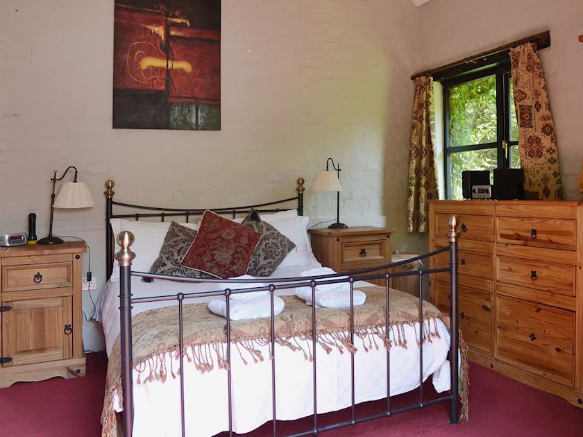 The antique style double bed is both romantic and comfortable` | Brook Barn - Brook and Meadow Barns, Shobley, Ringwood