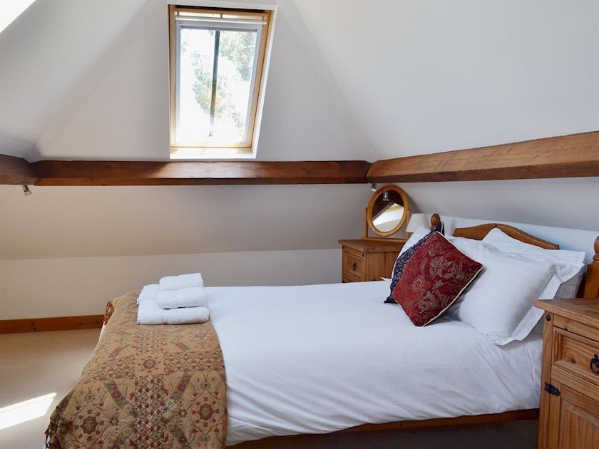 The first floor double bedroom has sloping ceilings and roof windows | Brook Barn - Brook and Meadow Barns, Shobley, Ringwood