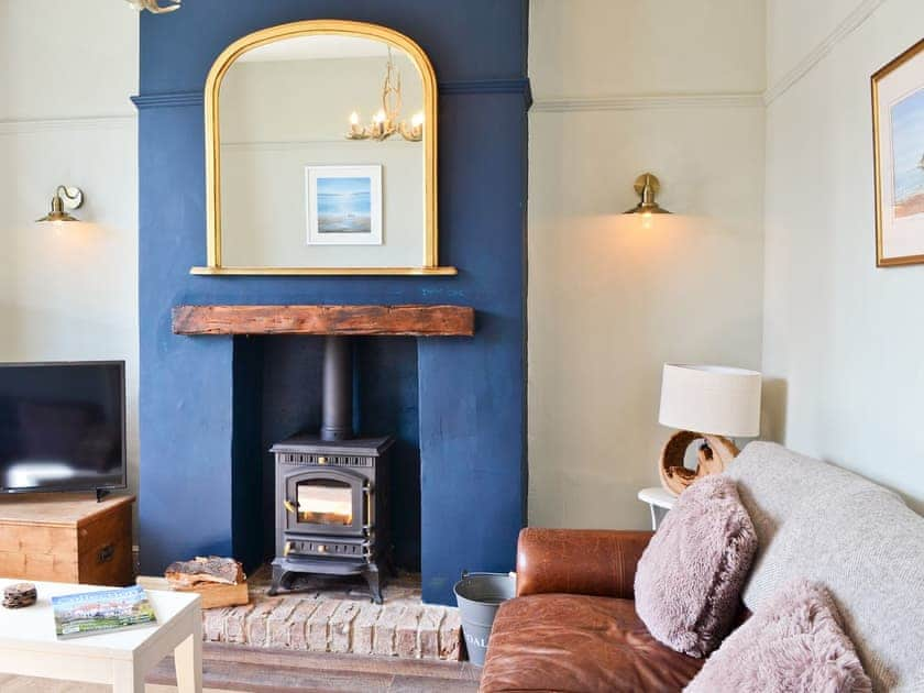 Comfortable living room with wood burner | Driftwood Cottage, Seahouses