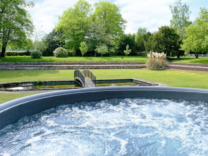 Hot tub in beautiful garden | Summer House, St Asaph