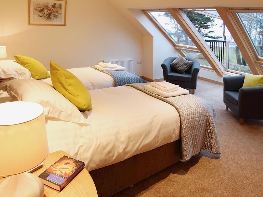 The first floor bedroom has panoramic views over the Firth of Forth and can be configured as either a twin or double | HomelandsDrummochy, Lundin Links near Anstruther