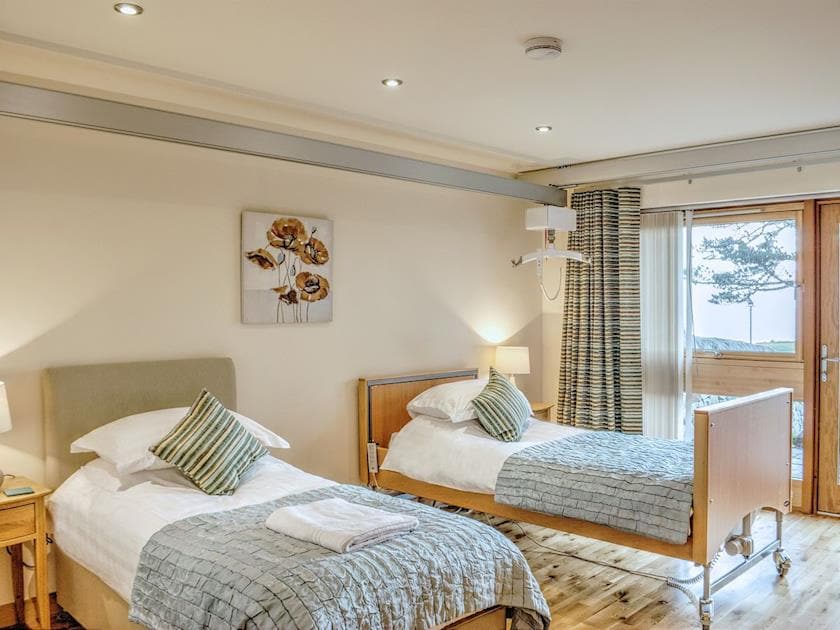 The twin bedded room is well furnished and decorated to a high standard | , 