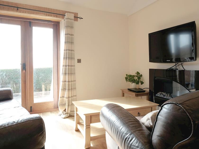 Cosy living area  | Dewdrop Dairy - Wooldown Holiday Cottages, Marhamchurch, near Bude