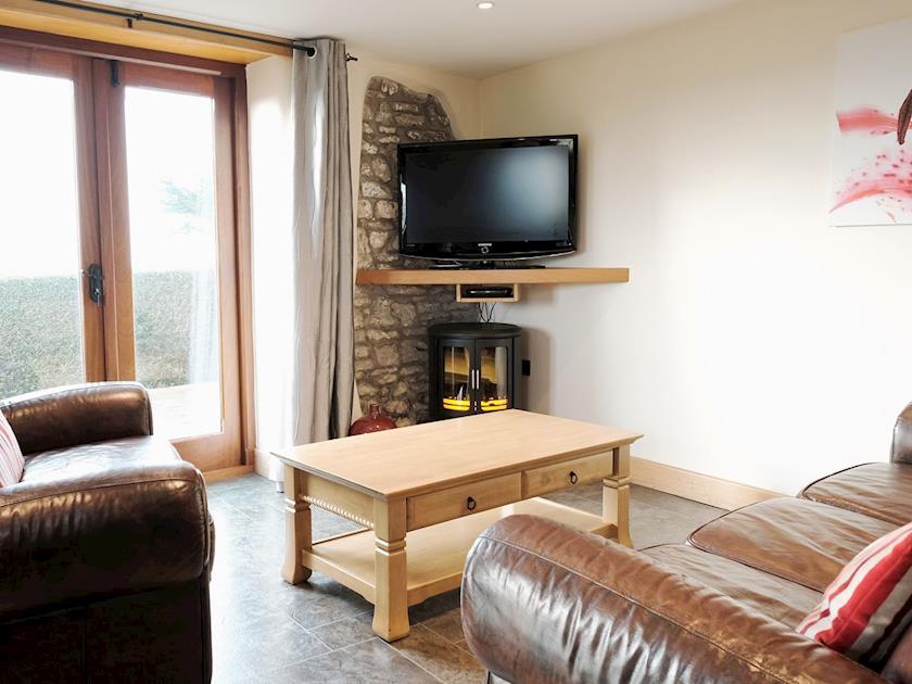Cosy living area | Pengenna Parlour - Wooldown Holiday Cottages, Marhamchurch, near Bude