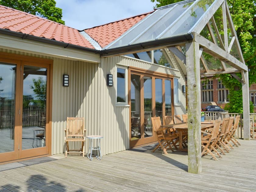 Spacious decked terrace | The Pavilion, Killerby, near Scarborough