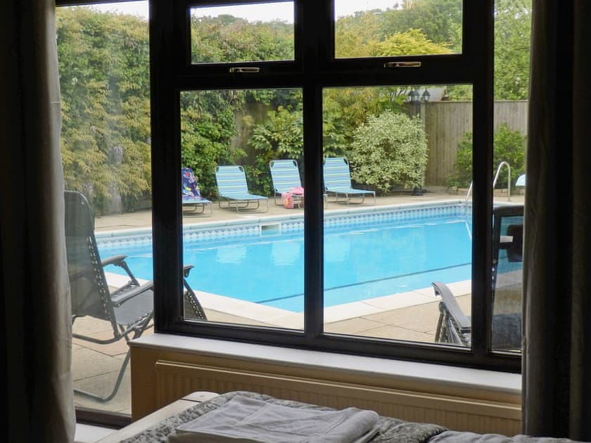 Swimming pool view from bedroom | The Beech House, Corton, near Lowestoft