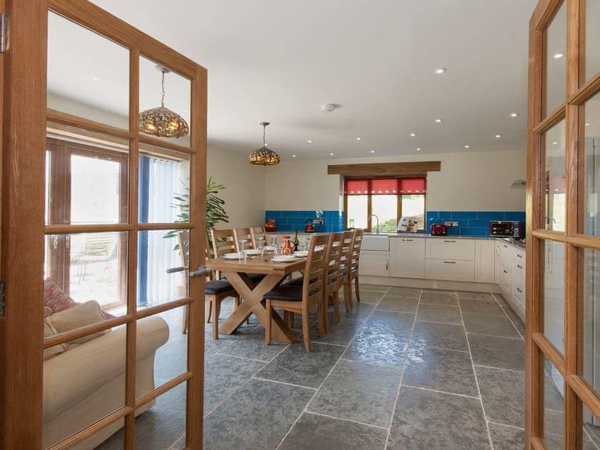 Ground floor kitchen diner with double doors opening on to the patio | Blackdown Farm, Manor Barn, Blackawton, nr. Dartmouth