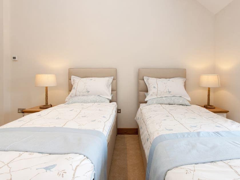 The twin bedroom features two 3ft zip and link beds that can be reconfigured to a super king size bed if required | Blackdown Farm, Manor Barn, Blackawton, nr. Dartmouth