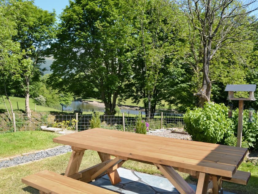 Beautiful garden overlooking the River Derwent | Howe Bridge House, near Portinscale