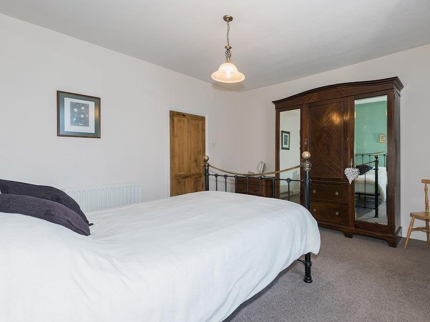Double bedroom with antique style metal bedstead | Lazy Cottage, Haverigg, near Millom