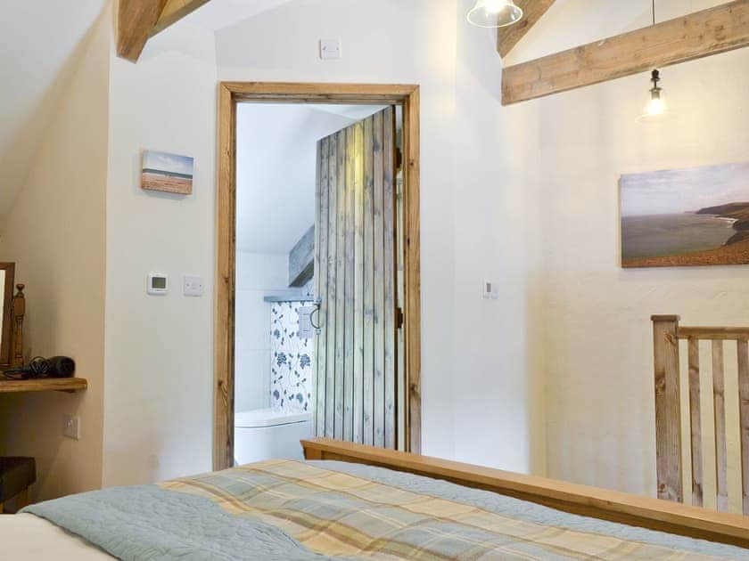 Exposed wooden beams throughout  | Snuggle Cottage - Dolgoy Cottages, Llangrannog