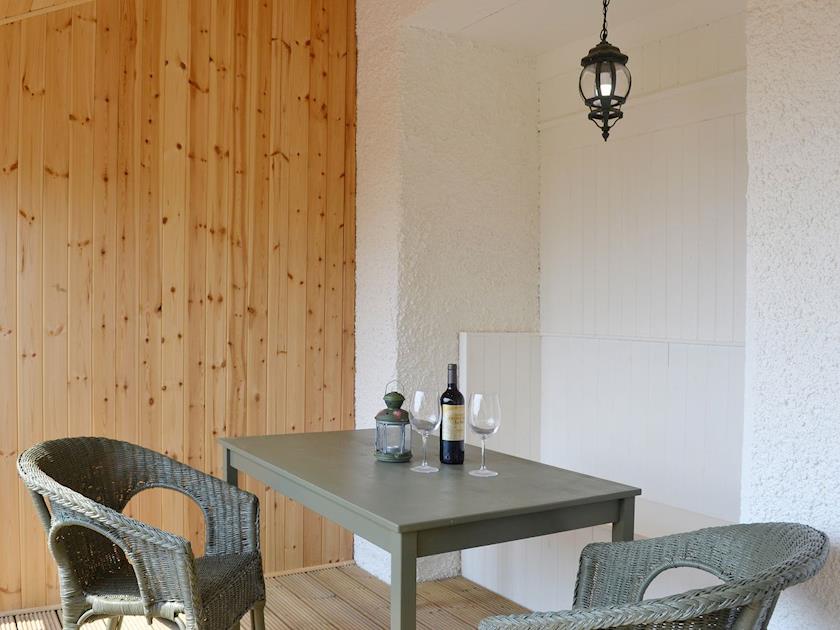 There is a private outdoor eating area | The Mews - Lakeview Cottages at Mondhui, Port of Menteith