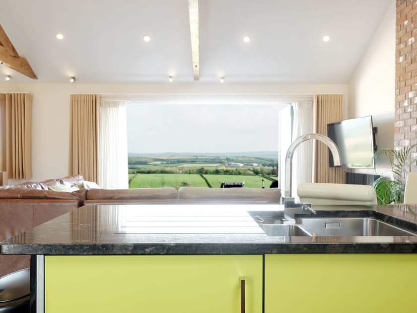 Kitchen also benefits from the great view | Moonshine - Wooldown Holiday Cottages, Marhamchurch, near Bude