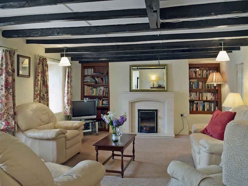 Spacious living room with beams | Ty Cornel, Aberporth, near Cardigan