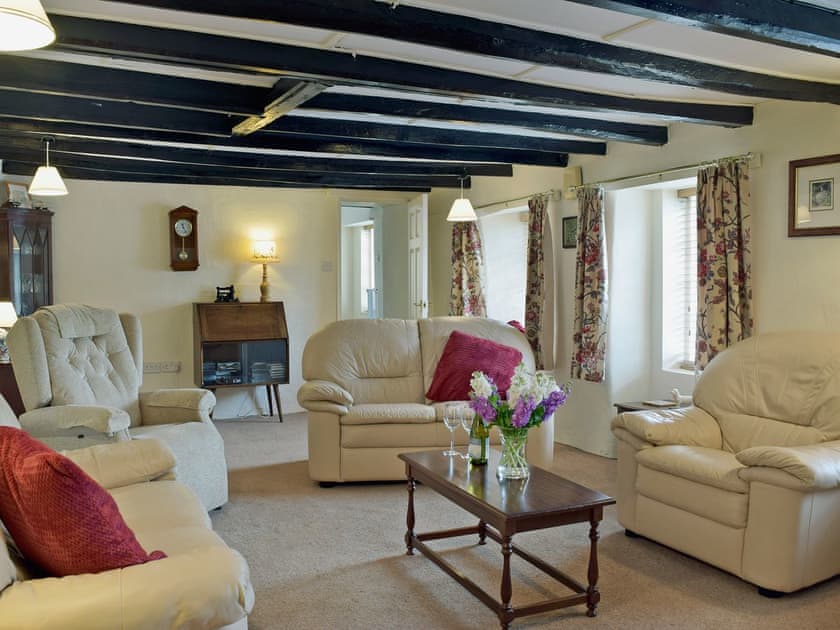 Spacious living room with beams | Ty Cornel, Aberporth, near Cardigan