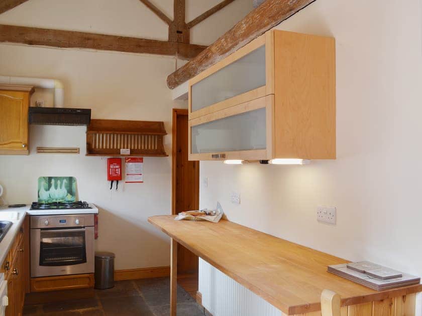 Galley style kitchen with wooden worktops | Barn Owl Cottage - Willersley Farm, Cromford, near Matlock