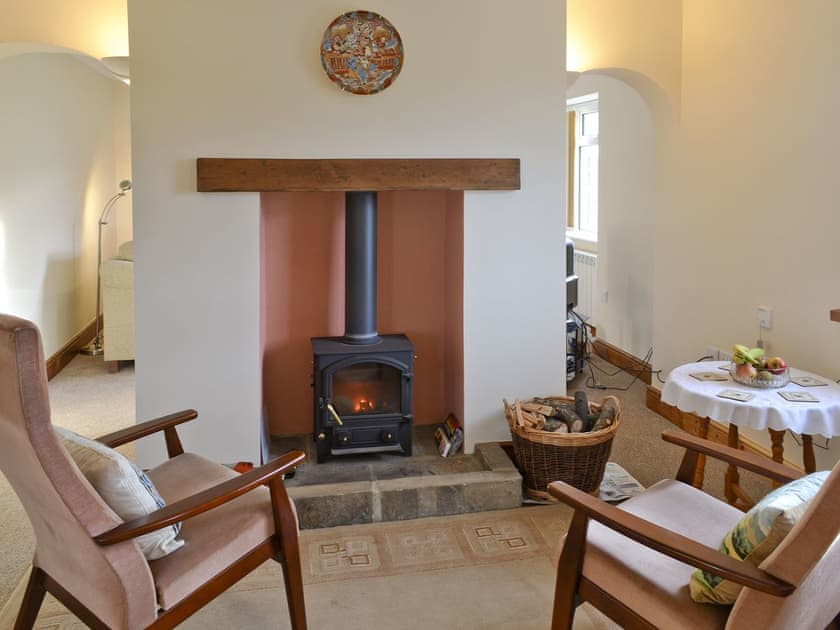 Additional seating area with wood-burner , adjoining lounge aera | Orchard Cottage, Old Liverton Village, near Whitby
