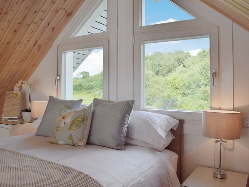 Galleried bedroom with high sloping ceiling | Heron Lodge, Five Roads, near Llanelli