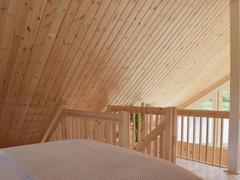 Bedroom with commanding views out over the rolling countryside | Heron Lodge, Five Roads, near Llanelli