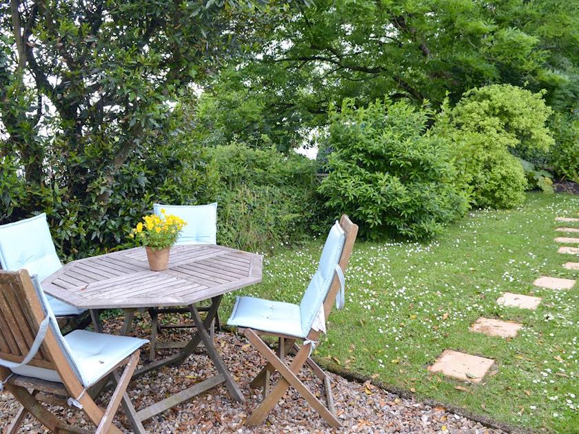 Sitting out area with lawned front garden | Hay Cottage, St Austell
