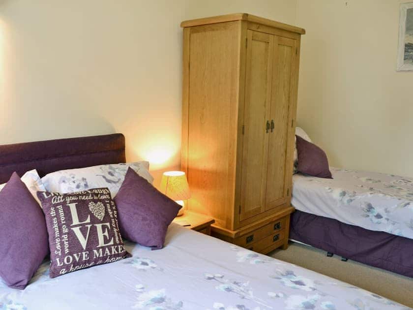 Comfortable bedroom with double bed and single bed | Blackthorn Cottage, Swan Pool, near Falmouth