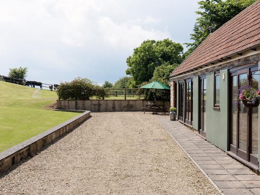 Gravelled patio at front | Bramble Cottage, Foxcote, near Radstock