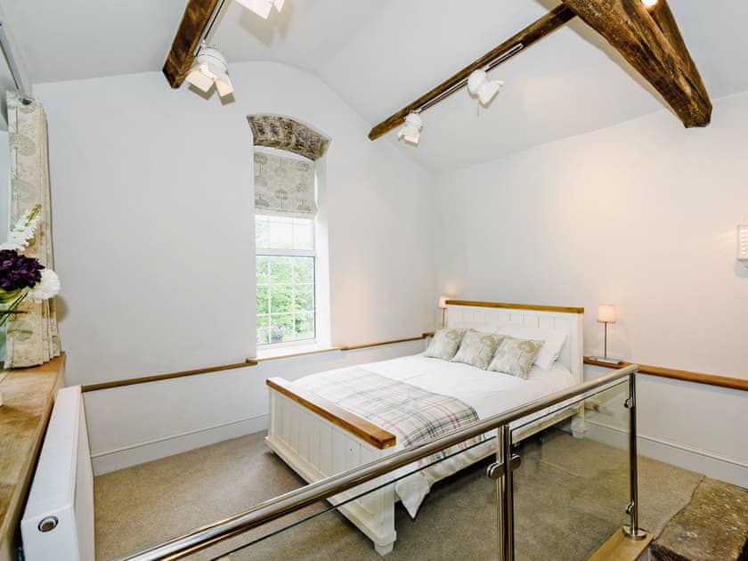 Luxurious split level room with beams, king size bed and wood burner  | The Old Mill, Great Strickland near Penrith