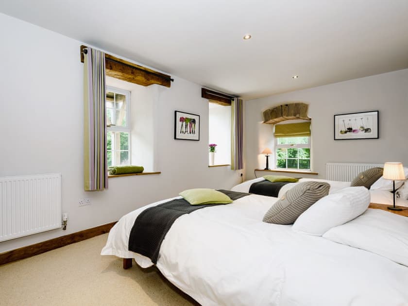 Comfortable bedroom with two double beds  | The Old Mill, Great Strickland near Penrith