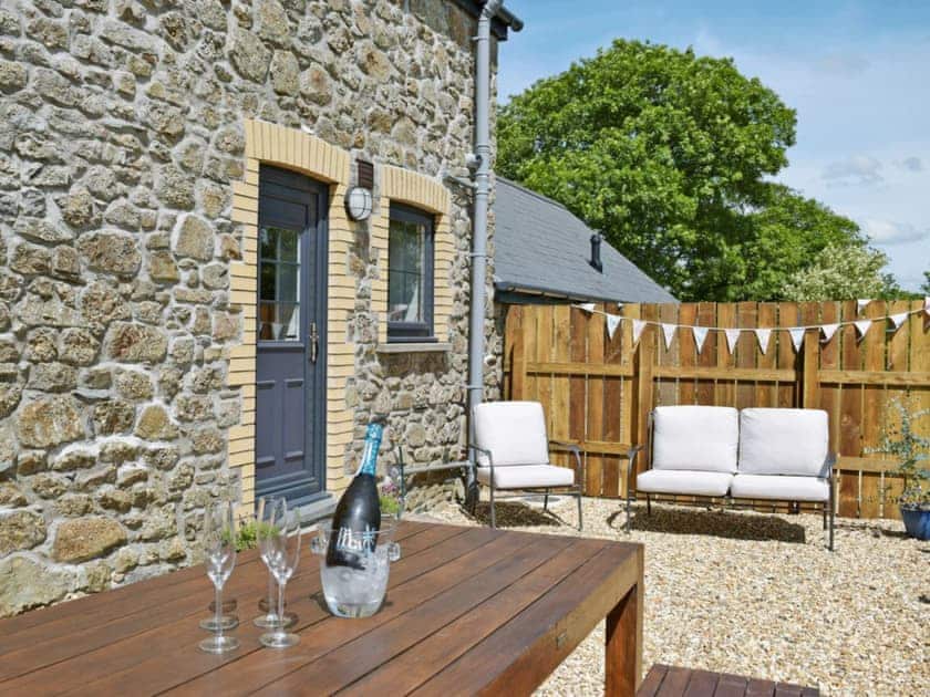 Small, enclosed, courtyard with sitting-out area | Bird Song Cottage - Vaynor Fach Cottages, Clynderwen, near Narberth