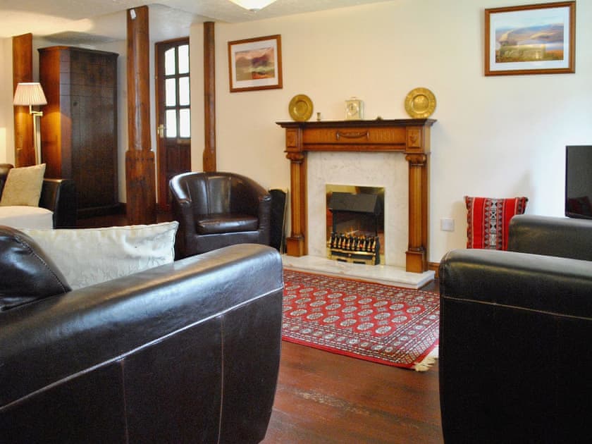 Delightful wood floored living room with feature fireplace | The Dovery, Ingmire Hall, Sedbergh