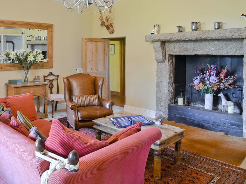 Entrance hall/snug with feature fireplace | Toad Hall - Libbear Barton, Shebbear, near Bude