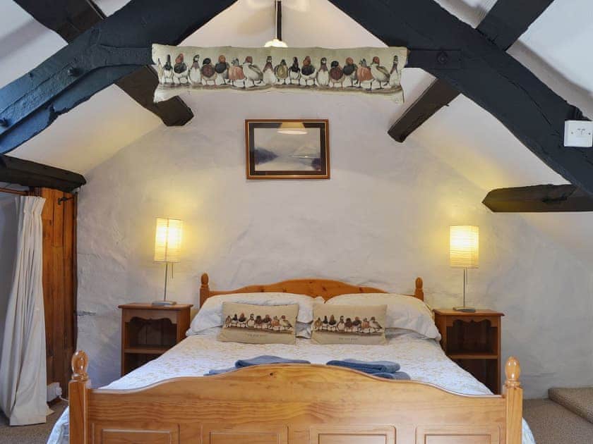 Lovely romantic bedroom with low beams | The Hayloft Barn - Tyddyn Iolyn, near Criccieth