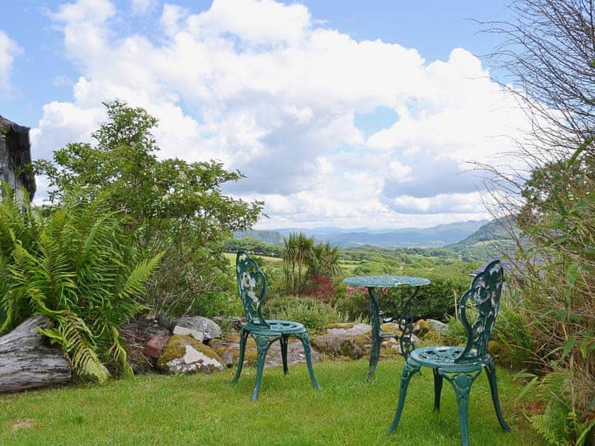 Spectacular view from the sitting out area in the small garden | The Hayloft Barn - Tyddyn Iolyn, near Criccieth