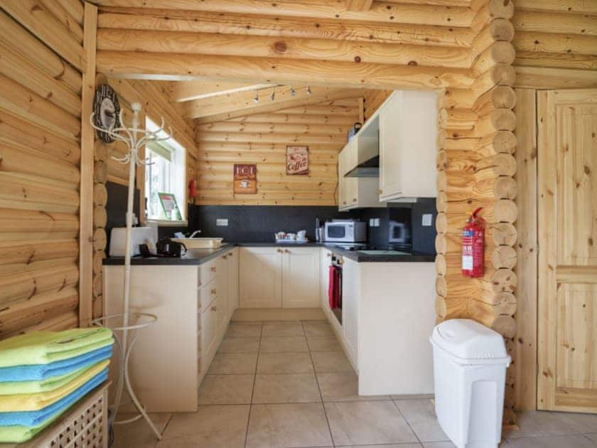 A compact well-fitted galley style kitchen | Quail Lodge - Mackinder Farms, Brayton, Selby