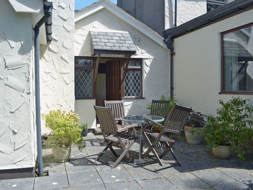 Enclosed lawned garden with patio | Pant Glas Mawr Cottage, Axton, near Holywell