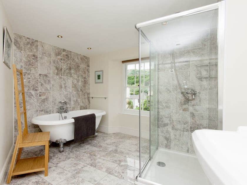 Stylish bathroom with separate roll top bath and shower cubicle | Hawkins, Dartmouth