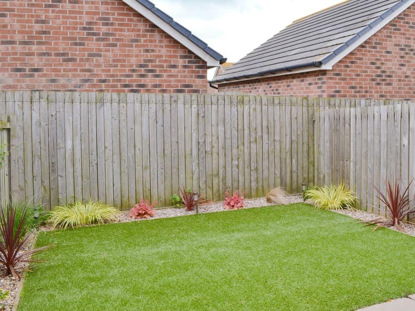 Enclosed garden with garden furniture | Sea Breeze, Beadnell, near Seahouses