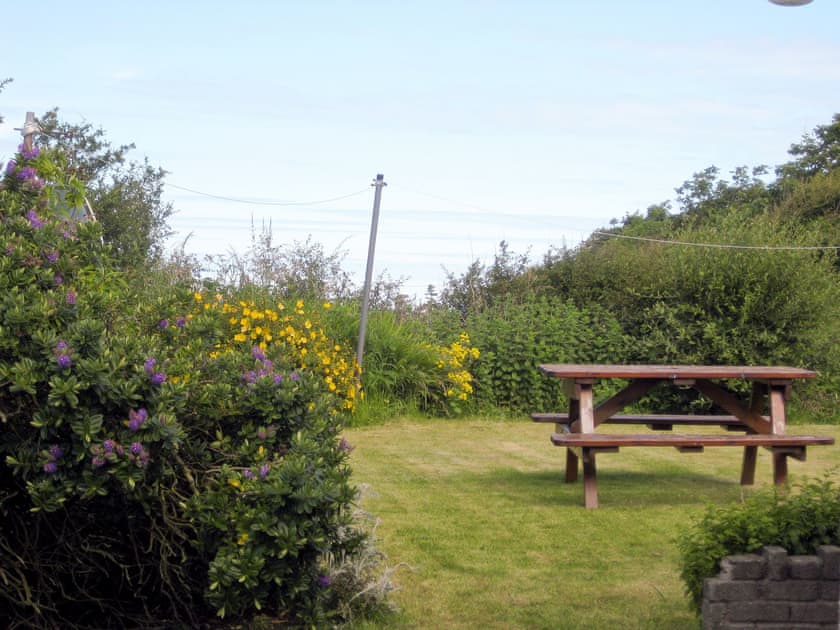 Lawned rear garden with sitting out area | Salfur, Rhiw, near Pwllheli