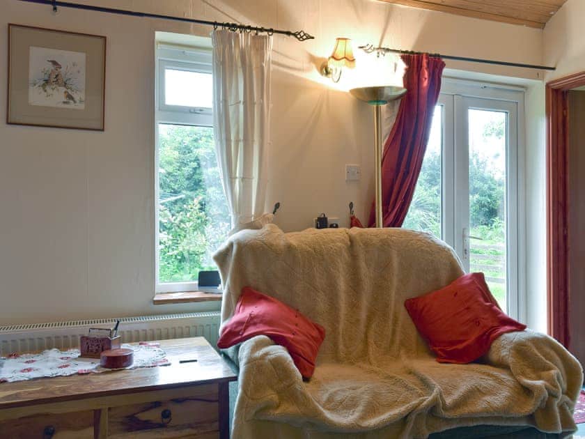 Comfy seating and French doors to garden | Mickrandella, Rollesby