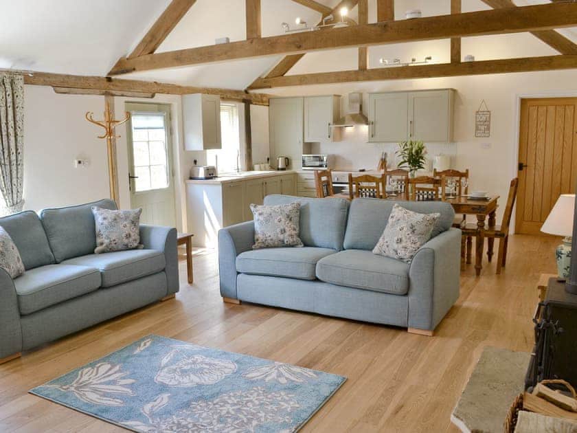Open plan living space boasting character features, oak flooring & woodburner | Squirrel’s Drey - Manor Farm Barns, Witton, near Happisburgh