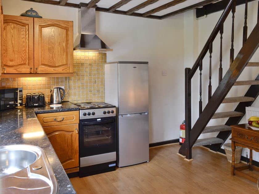 Spacious kitchen with stairs to upper level | Y Bwthyn, Bala
