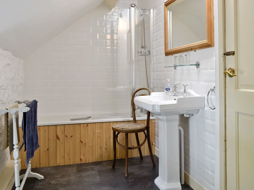 Family bathroom with shower over bath | Riverside Cottage, Betws-y-Coed