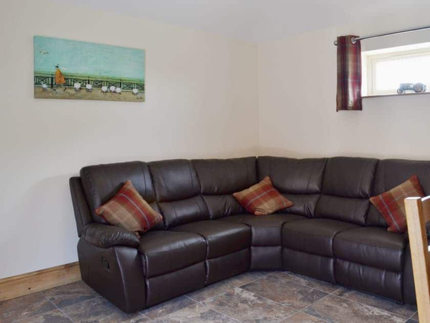 Comfortable leather sofas in the open plan living area | The Old Dairy - Dunstall Lodge Barns, Sutton-on-Trent