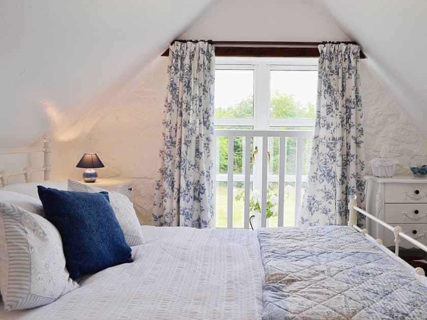 Spacious and romantic double bedroom with sloping ceiling | Woodside Cottage, Nether Bellandy, Glenrinnes, near Keith