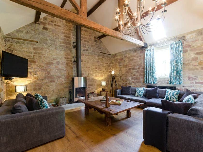 Open plan living space lounge area with wood burner | Woodpecker Loft - Millfields Farm, near Carsington