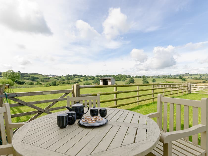Outdoor dining area with stunning countryside views | Barn Owl Lodge - Millfields Farm, near Carsington