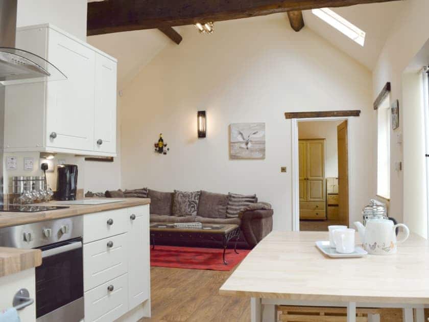 Open plan living/dining room/kitchen with beams throughout | The Smithy, Little Witley, near Worcestershire
