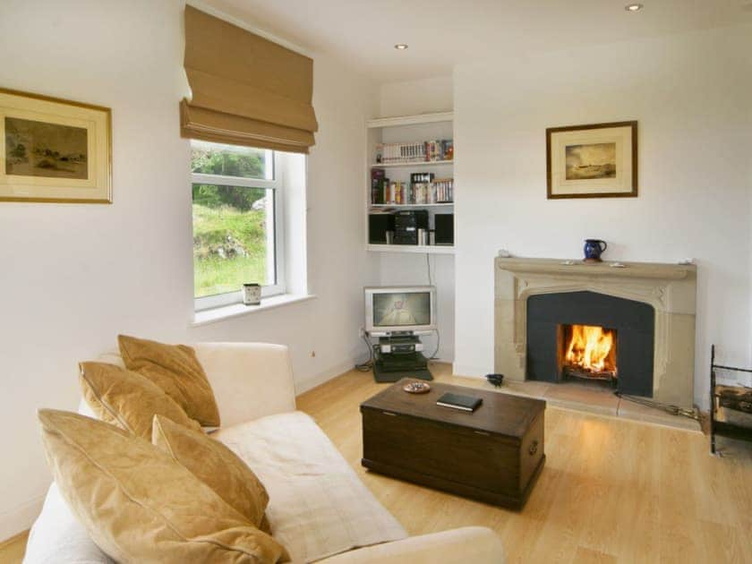 Open plan living space with open fire | Tigh Beg Croft, Lerags, near Oban